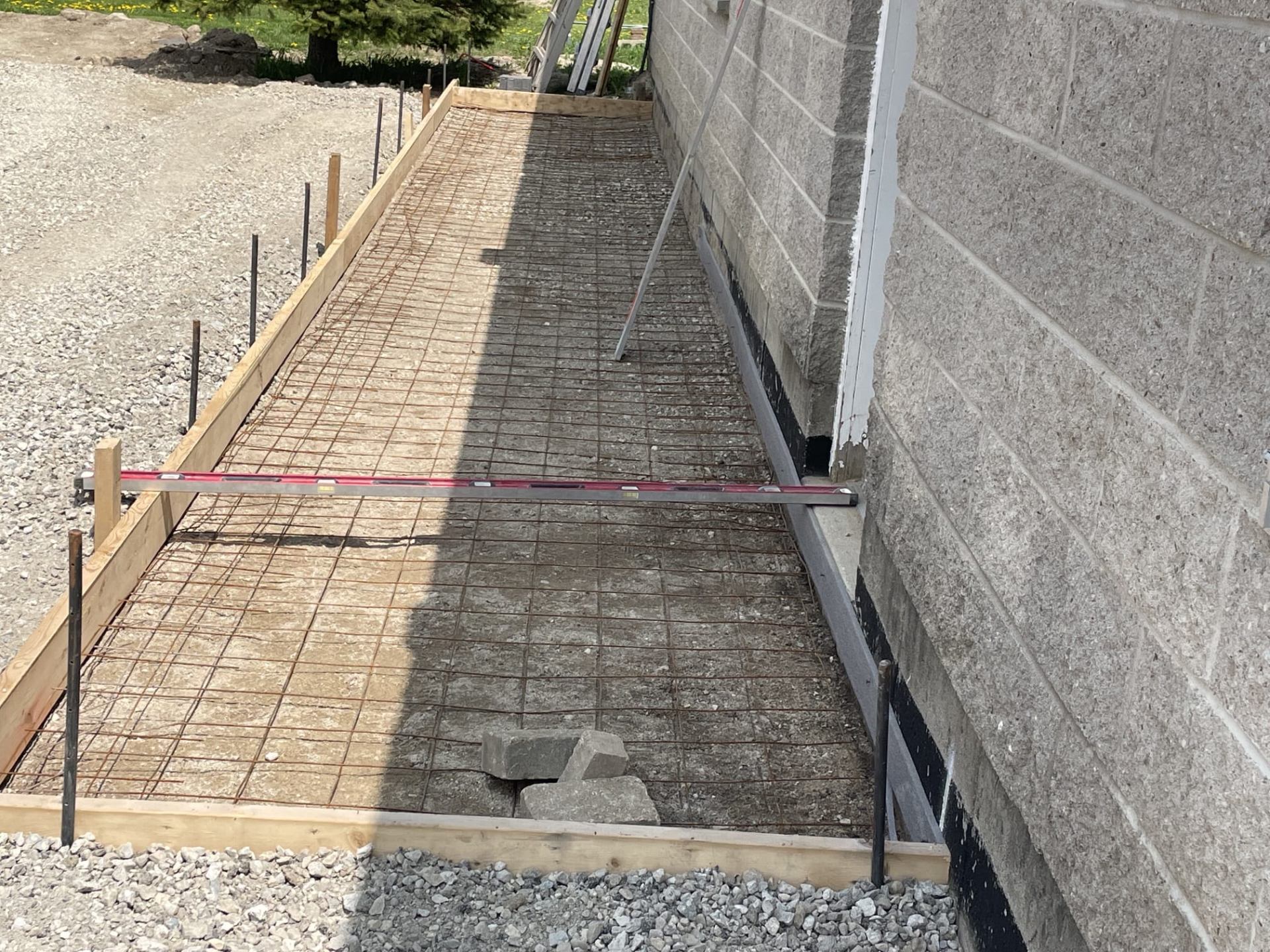 Concrete sidewalk installation — before